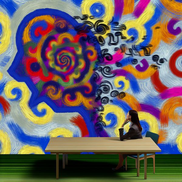Afgeleid Persoon aan Vergadertafel met Doodles Abstracte afbeelding van een persoon aan een vergadertafel met chaotische, kleurrijke patronen die afleiding symboliseren.